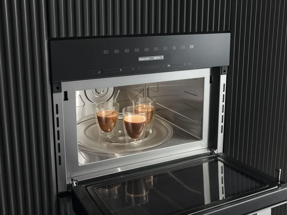 Built-in speed oven in dark cabinetry